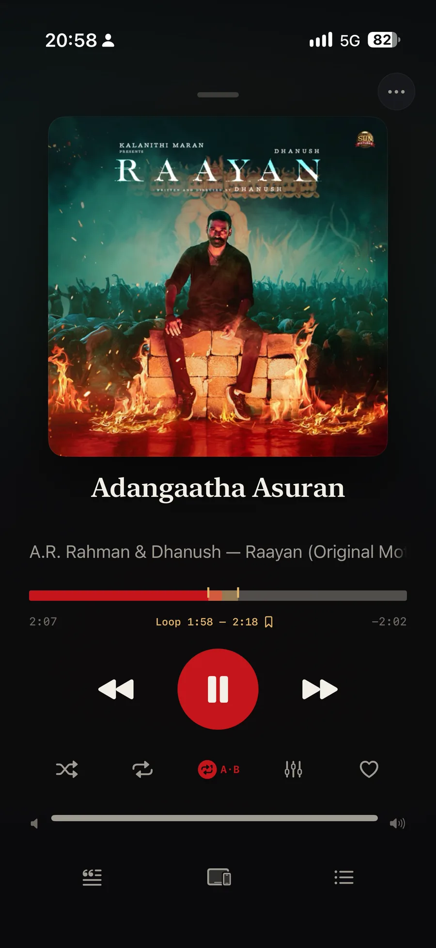 An A/B loop running in Isai over Adangaatha Asuran from Raayan: the progress bar carries a marked region between 1:58 and 2:18, the readout under it reads Loop 1:58 to 2:18 beside a bookmark, and the A/B button is lit red.